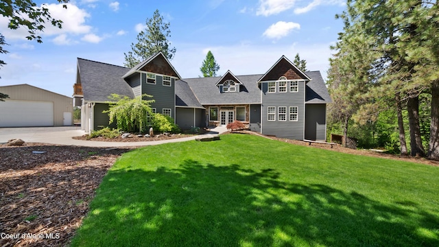 craftsman house featuring a front lawn, french doors, an outbuilding, a shingled roof, and a detached garage