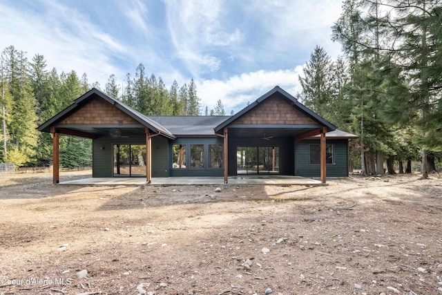 back of house with a ceiling fan and a patio area