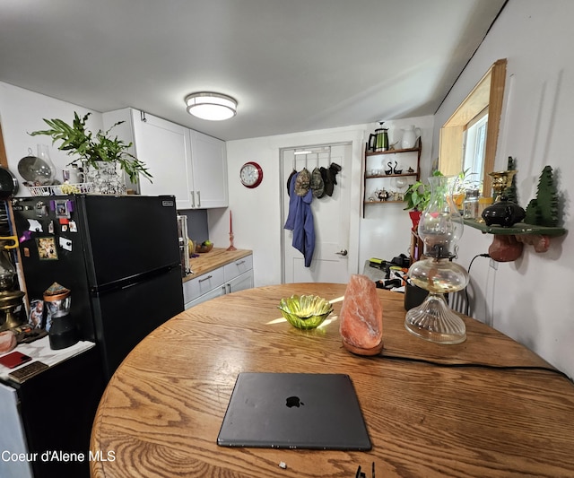 1428 W Elkhorn Meadows Rd, Fernwood, ID 83830 - kitchen featuring freestanding refrigerator and white cabinetry