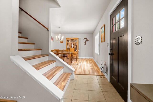 346 Brookfield Rd, Sandpoint, ID 83864 - foyer featuring stairs, a chandelier, and light tile patterned floors