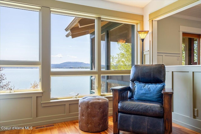 sunroom / solarium featuring a mountain view