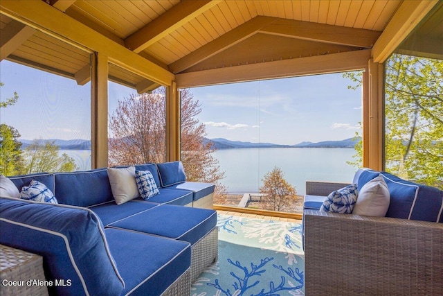 view of patio with an outdoor hangout area and a water view
