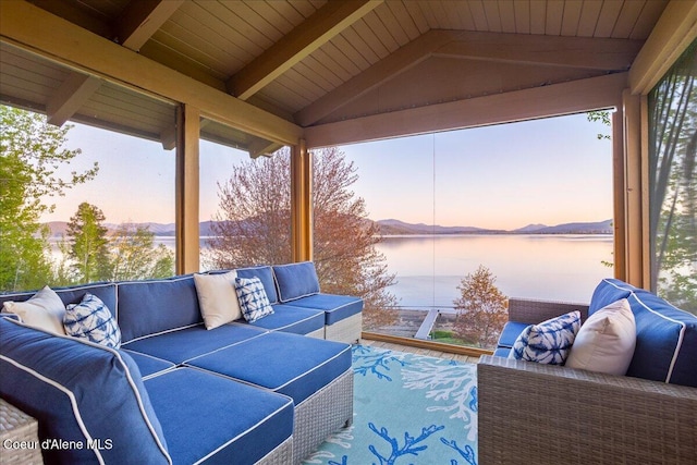 sunroom / solarium with an outdoor hangout area and a water view