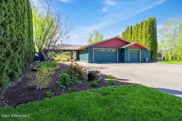 view of front of property featuring board and batten siding and a front yard