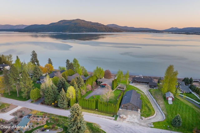 712 Ponder Point Dr, Sandpoint, ID 83864 - aerial view at dusk of a water and mountain view and a residential view
