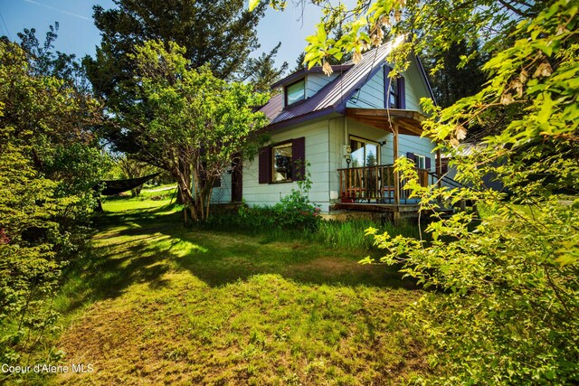 50 Smokehouse Rd, Sagle, ID 83860 - view of side of home with a lawn and metal roof