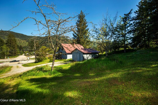 50 Smokehouse Rd, Sagle, ID 83860 - view of yard with driveway and a mountain view