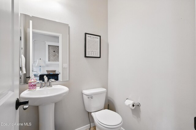 1823 N Clark Fork Pkwy, Post Falls, ID 83854 - half bathroom with toilet and baseboards
