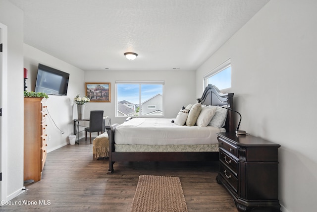 1823 N Clark Fork Pkwy, Post Falls, ID 83854 - bedroom featuring dark wood-type flooring and baseboards