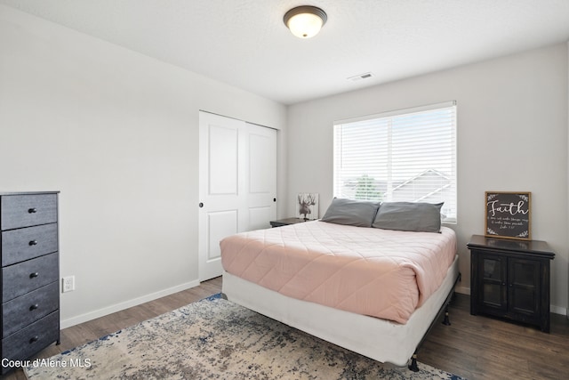 1823 N Clark Fork Pkwy, Post Falls, ID 83854 - bedroom featuring wood finished floors, baseboards, and a closet