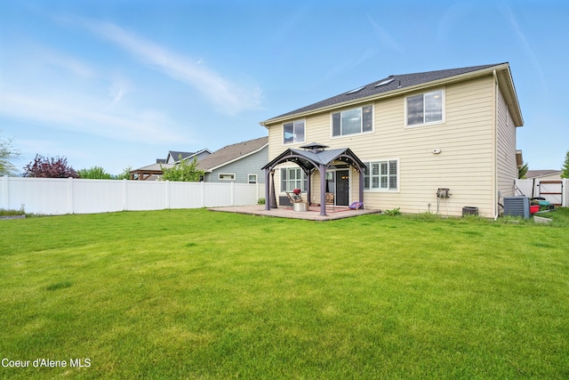 1823 N Clark Fork Pkwy, Post Falls, ID 83854 - back of property with a gazebo, a patio, and central AC