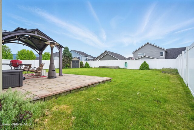 1823 N Clark Fork Pkwy, Post Falls, ID 83854 - view of yard with a gazebo, a storage unit, a patio area, and an outdoor structure