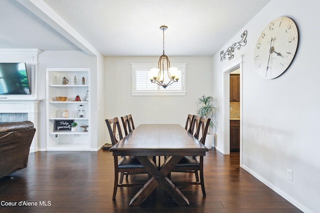 1823 N Clark Fork Pkwy, Post Falls, ID 83854 - dining space with a chandelier, dark wood-type flooring, baseboards, and built in features