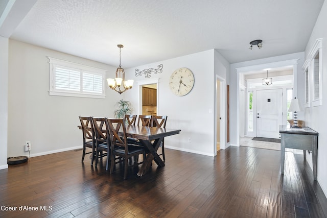 1823 N Clark Fork Pkwy, Post Falls, ID 83854 - dining room with a chandelier, baseboards, and dark wood finished floors