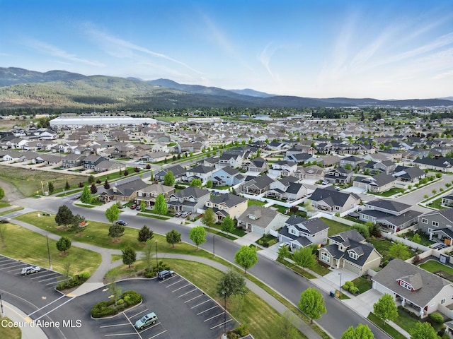 1823 N Clark Fork Pkwy, Post Falls, ID 83854 - aerial view of property and surrounding area with mountains and nearby suburban area
