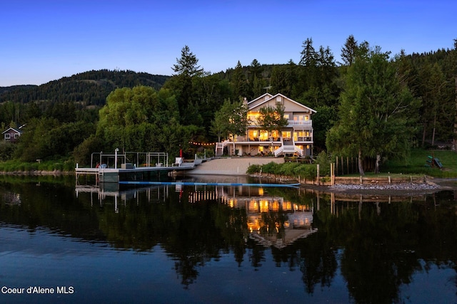 679 Comeback Bay Ln, Sagle, ID 83860 - water view featuring a heavily wooded area, a boat dock, and boat lift