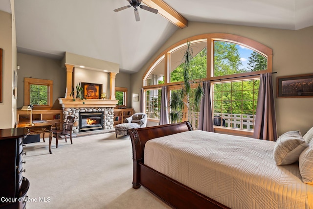 679 Comeback Bay Ln, Sagle, ID 83860 - bedroom featuring light carpet, beamed ceiling, a fireplace, high vaulted ceiling, and ceiling fan