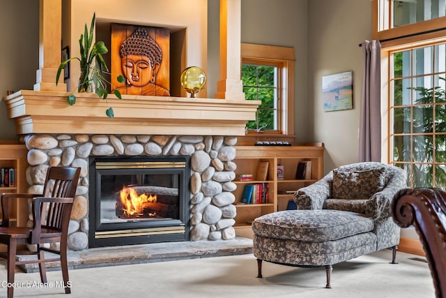 679 Comeback Bay Ln, Sagle, ID 83860 - sitting room with a stone fireplace and carpet floors