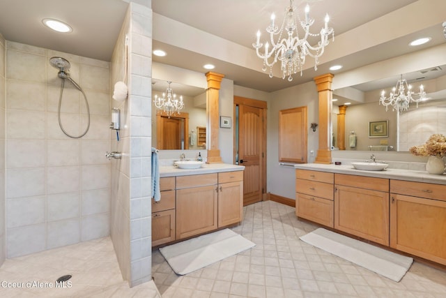 679 Comeback Bay Ln, Sagle, ID 83860 - bathroom featuring a chandelier, two vanities, a walk in shower, recessed lighting, and ornate columns