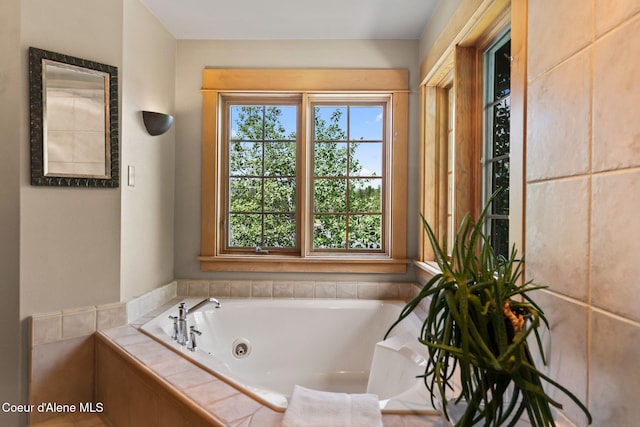 679 Comeback Bay Ln, Sagle, ID 83860 - bathroom featuring healthy amount of natural light and a tub with jets