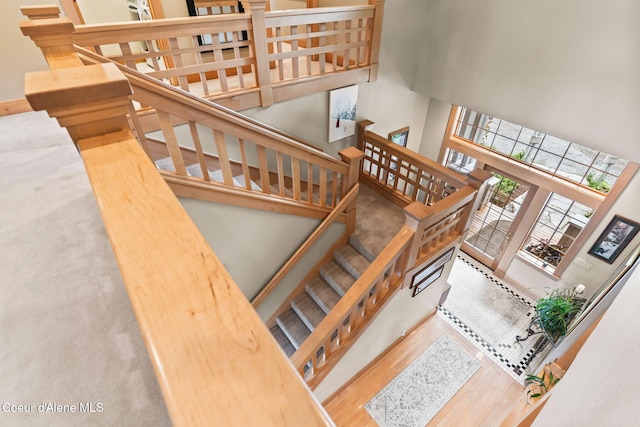 679 Comeback Bay Ln, Sagle, ID 83860 - staircase featuring wood finished floors and a high ceiling