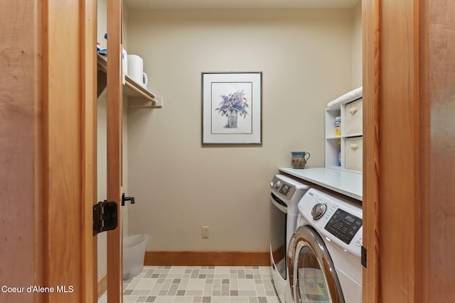 679 Comeback Bay Ln, Sagle, ID 83860 - washroom featuring washing machine and clothes dryer and baseboards