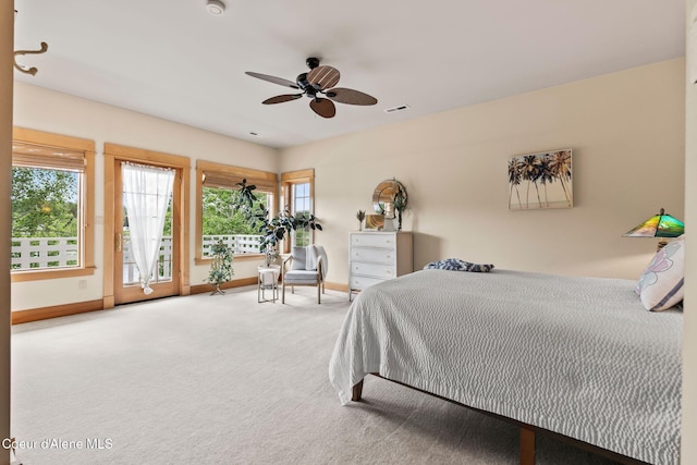 679 Comeback Bay Ln, Sagle, ID 83860 - bedroom with multiple windows, carpet floors, and baseboards