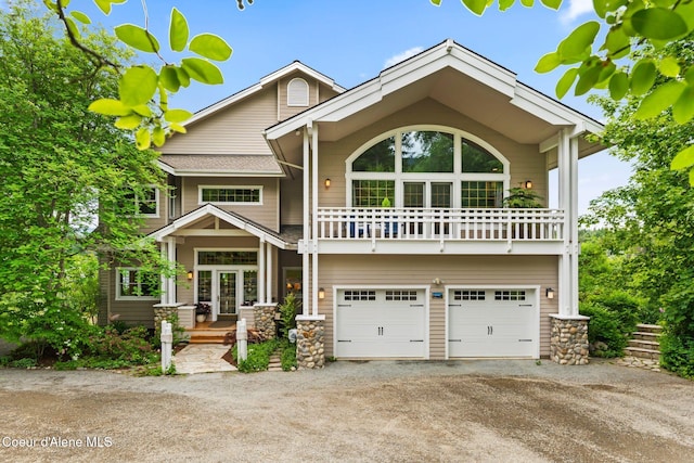 679 Comeback Bay Ln, Sagle, ID 83860 - view of front of property featuring dirt driveway, a garage, and a balcony