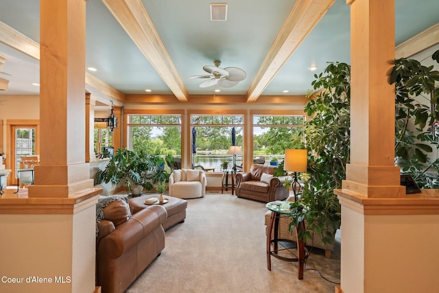 679 Comeback Bay Ln, Sagle, ID 83860 - living room featuring beam ceiling, ornate columns, ceiling fan, carpet flooring, and healthy amount of natural light