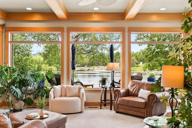 679 Comeback Bay Ln, Sagle, ID 83860 - sunroom / solarium with beamed ceiling, plenty of natural light, a water view, and carpet floors