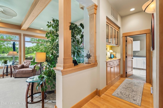 679 Comeback Bay Ln, Sagle, ID 83860 - hall with light wood-style flooring, beamed ceiling, and baseboards