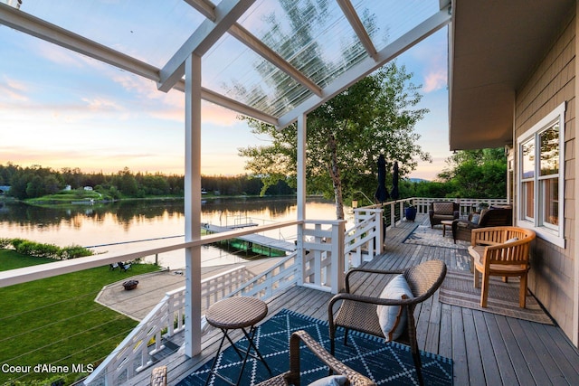 679 Comeback Bay Ln, Sagle, ID 83860 - deck at dusk featuring a water view