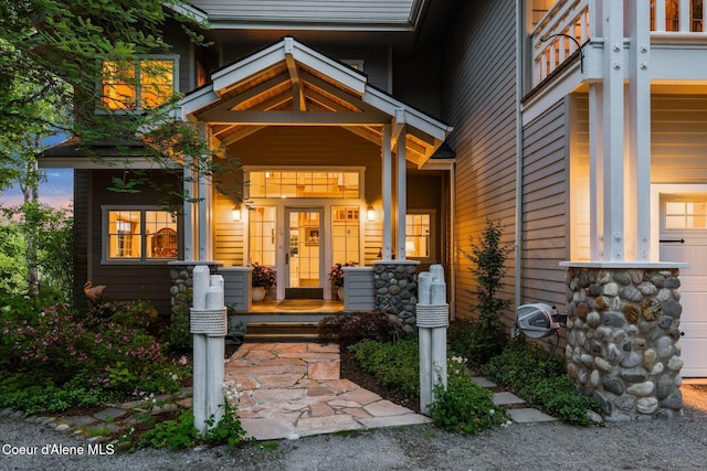 679 Comeback Bay Ln, Sagle, ID 83860 - entrance to property featuring a porch and a garage