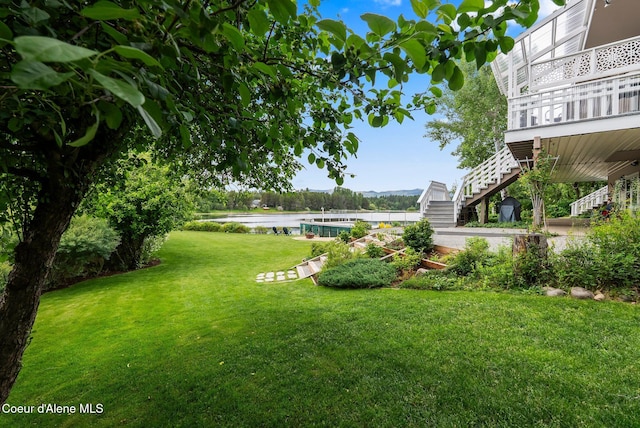 679 Comeback Bay Ln, Sagle, ID 83860 - view of grassy yard featuring stairs and a water view