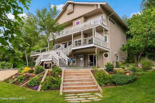 679 Comeback Bay Ln, Sagle, ID 83860 - view of front of property with stairs, a front lawn, and a vegetable garden
