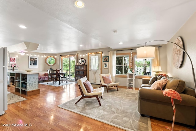 679 Comeback Bay Ln, Sagle, ID 83860 - living room featuring plenty of natural light, light wood-style floors, recessed lighting, and wine cooler