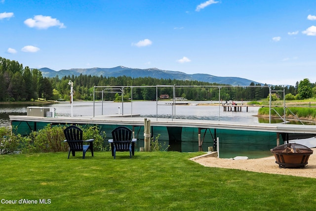 679 Comeback Bay Ln, Sagle, ID 83860 - view of pool featuring a lawn and a water and mountain view