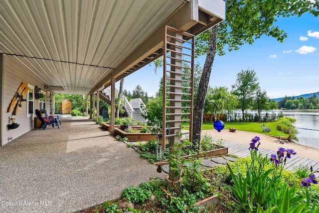 679 Comeback Bay Ln, Sagle, ID 83860 - view of patio with stairway and a water view