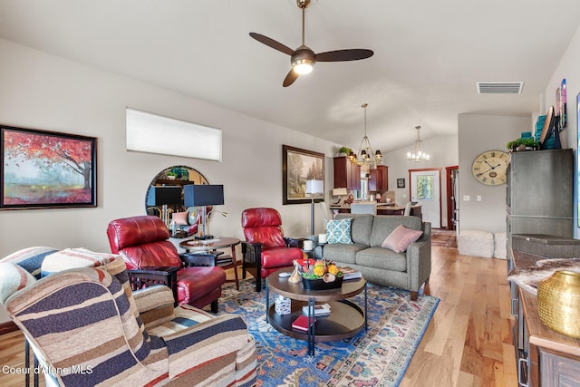 3313 N Rosalia Rd, Coeur Dalene, ID 83814 - living area featuring lofted ceiling, a chandelier, light wood-style flooring, and a ceiling fan