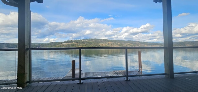 dock area featuring a water and mountain view