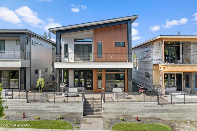 2855 W Lumber Ln, Coeur Dalene, ID 83814 - rear view of house featuring a balcony and a patio