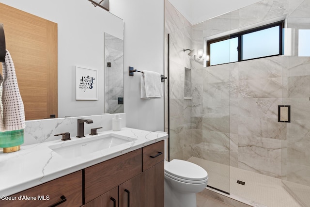 2855 W Lumber Ln, Coeur Dalene, ID 83814 - bathroom with vanity, a stall shower, and toilet