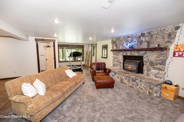 435 Shady Pines Loop, Priest Lake, ID 83856 - living room with a stone fireplace, baseboards, and recessed lighting