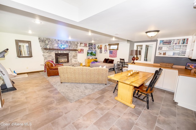 435 Shady Pines Loop, Priest Lake, ID 83856 - living area featuring a stone fireplace and baseboards