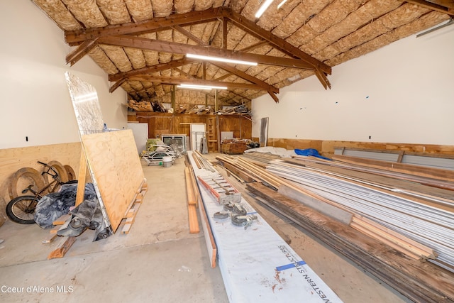 435 Shady Pines Loop, Priest Lake, ID 83856 - misc room with vaulted ceiling, concrete flooring, and a garage