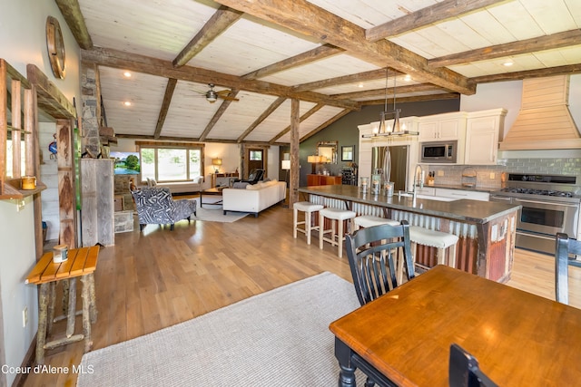 435 Shady Pines Loop, Priest Lake, ID 83856 - dining space with light wood-style floors, ceiling fan, and wood ceiling