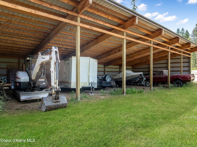 435 Shady Pines Loop, Priest Lake, ID 83856 - view of parking featuring a carport and an outbuilding