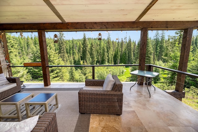 435 Shady Pines Loop, Priest Lake, ID 83856 - sunroom / solarium featuring a wooded view and an outdoor hangout area