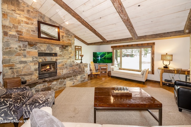 435 Shady Pines Loop, Priest Lake, ID 83856 - living area with wood finished floors, wood ceiling, and a stone fireplace