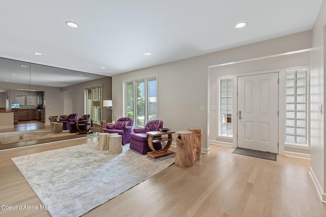 entryway featuring light wood-style floors, recessed lighting, and baseboards
